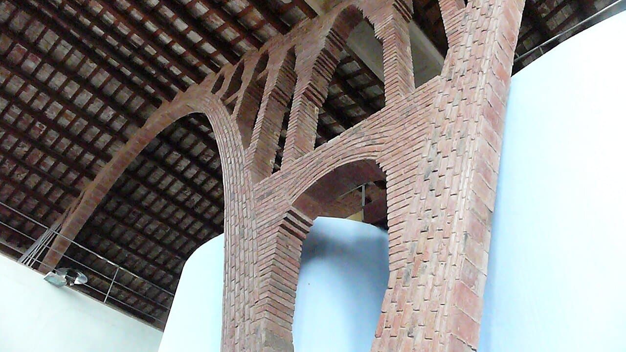 Tall brick arches supporting the roof of the Nulles cooperative winery