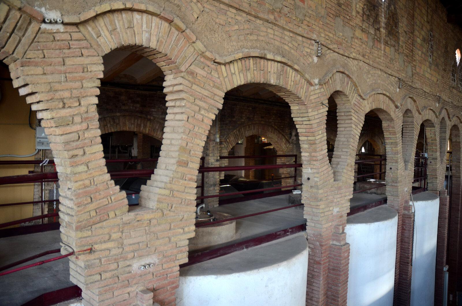 Brick arches above wine vats in Barberà de la Conca’s cooperative cellar